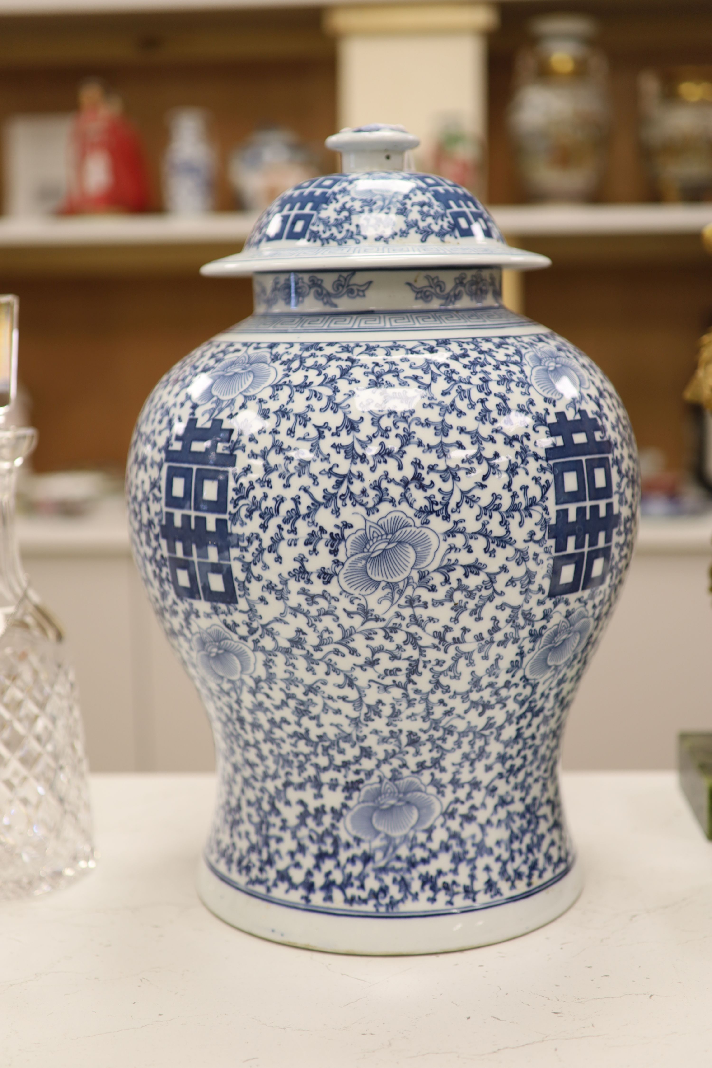 A large 20th century Chinese blue and white Shuangxi baluster vase and cover, height 32cm